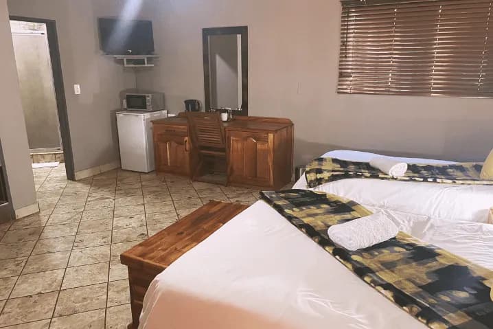 Family of 3 Room with double and single bed at The Wilds Lodge Kuruman